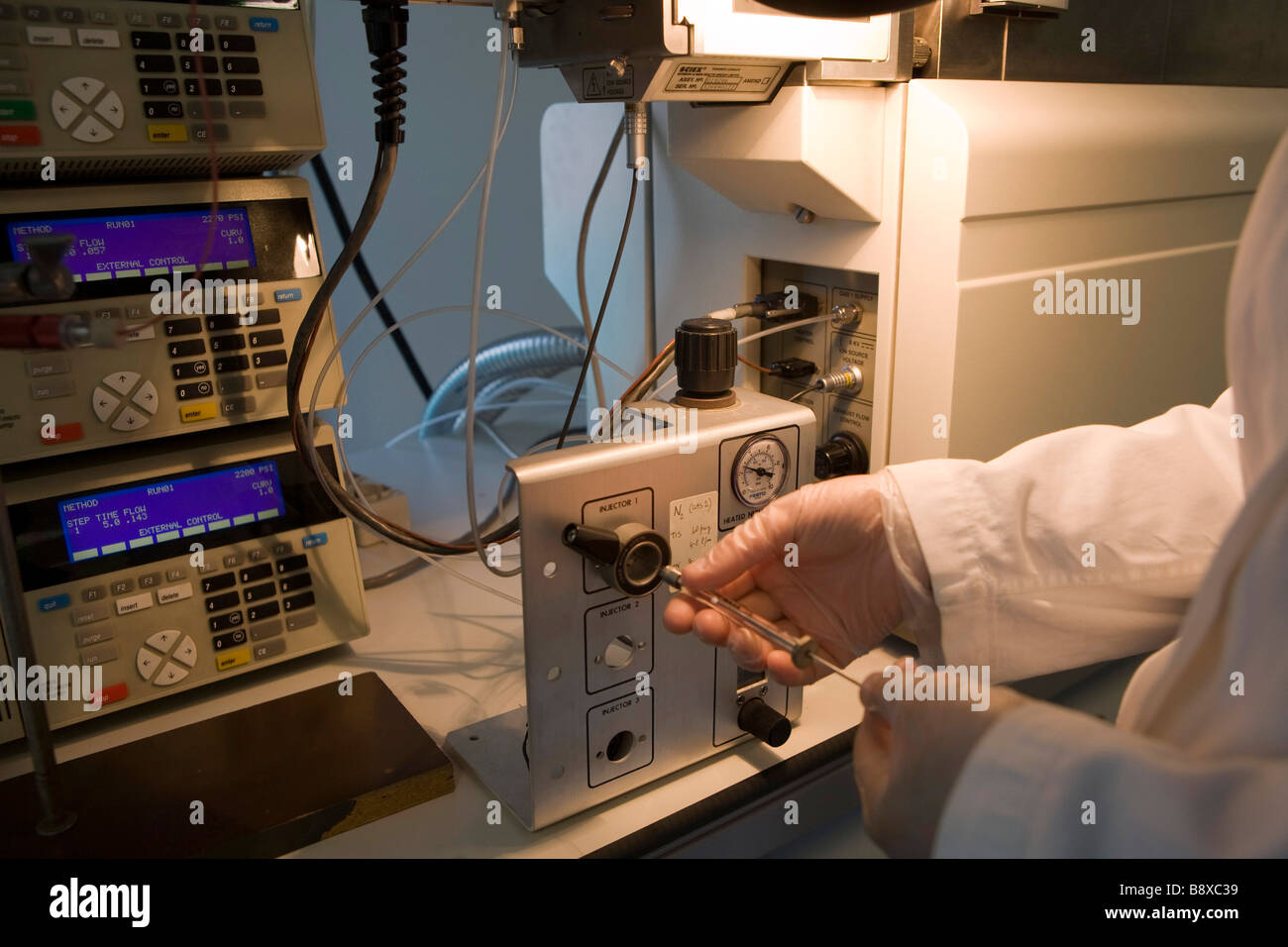 injector and mass spectrometer, istituto di ricerche farmacologiche mario negri, milan, italy Stock Photo