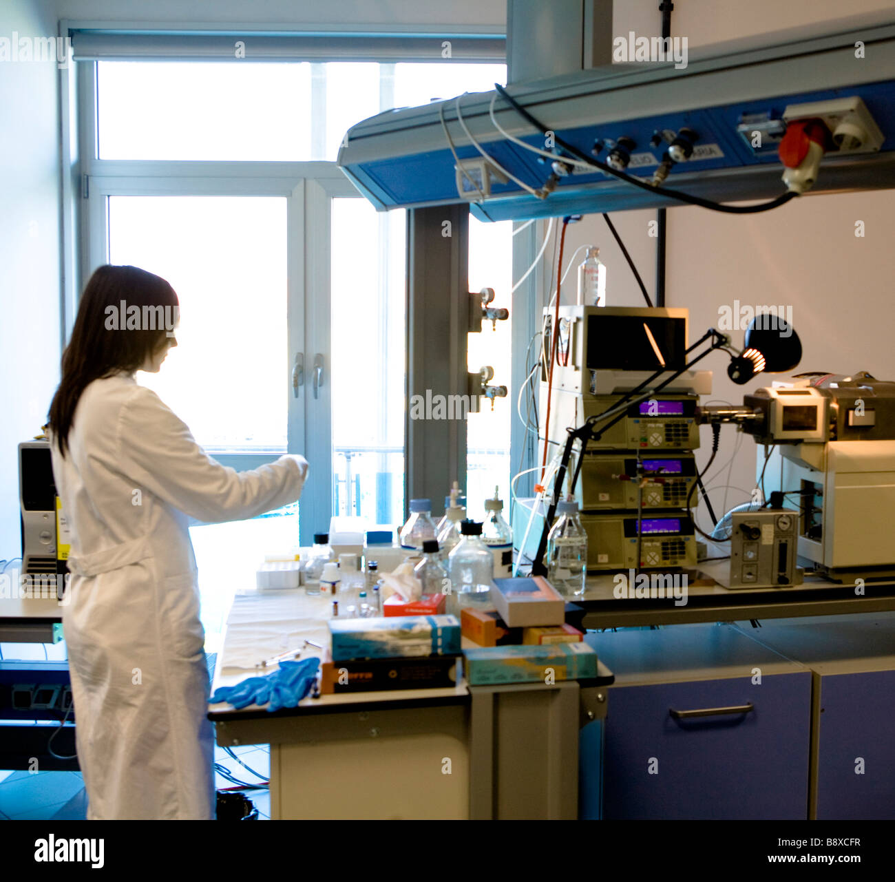 Researcher in mass spectrometry laboratory hires stock photography and