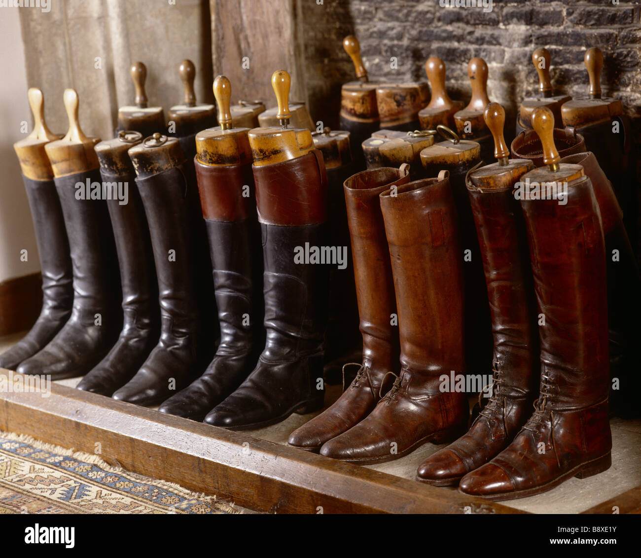 Leather boots lined up in the fireplace of the front stairs at Great ...