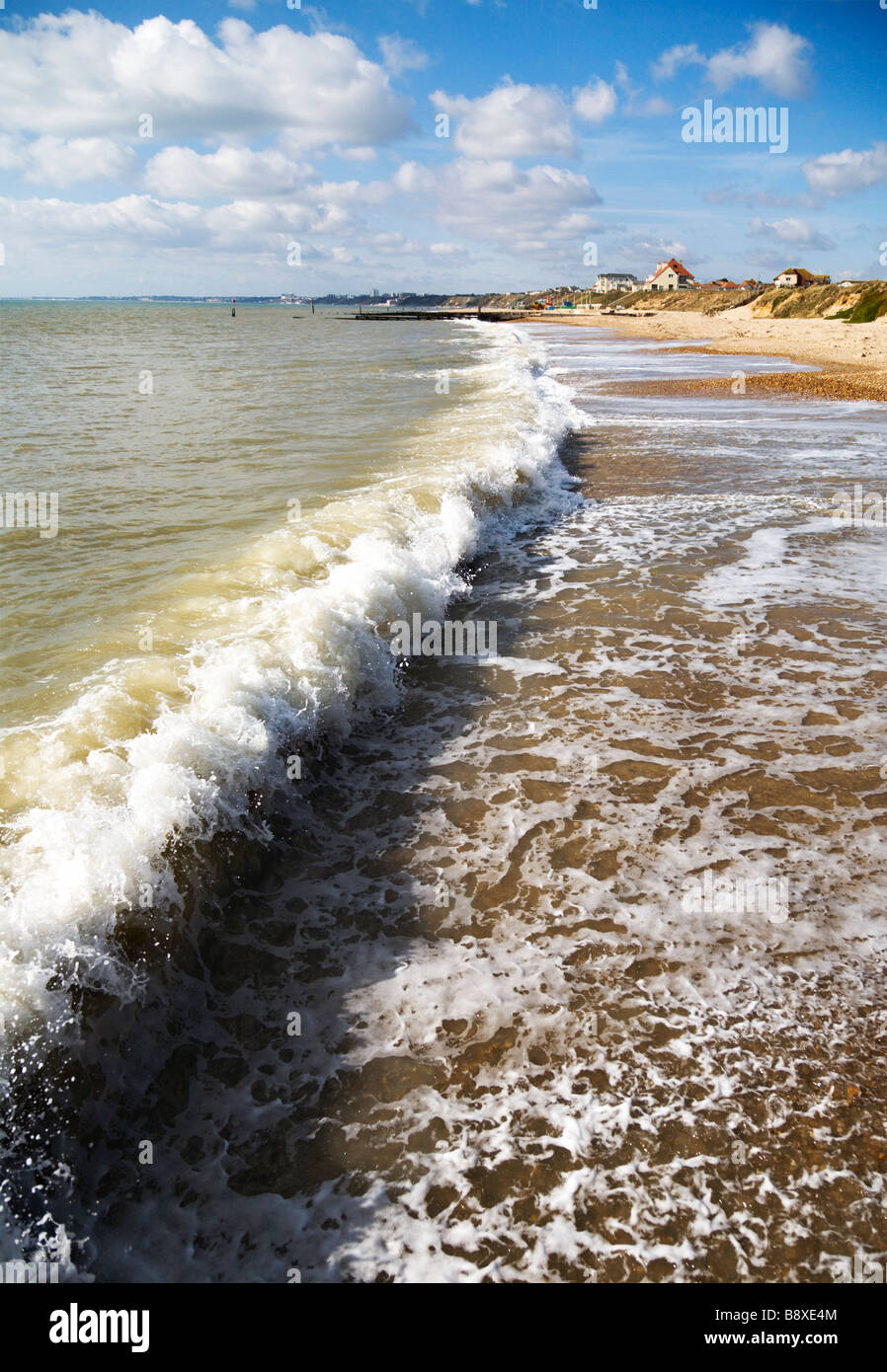 A wave breaking along the sandy beach, Bournemouth. Dorset. England. UK. Stock Photo