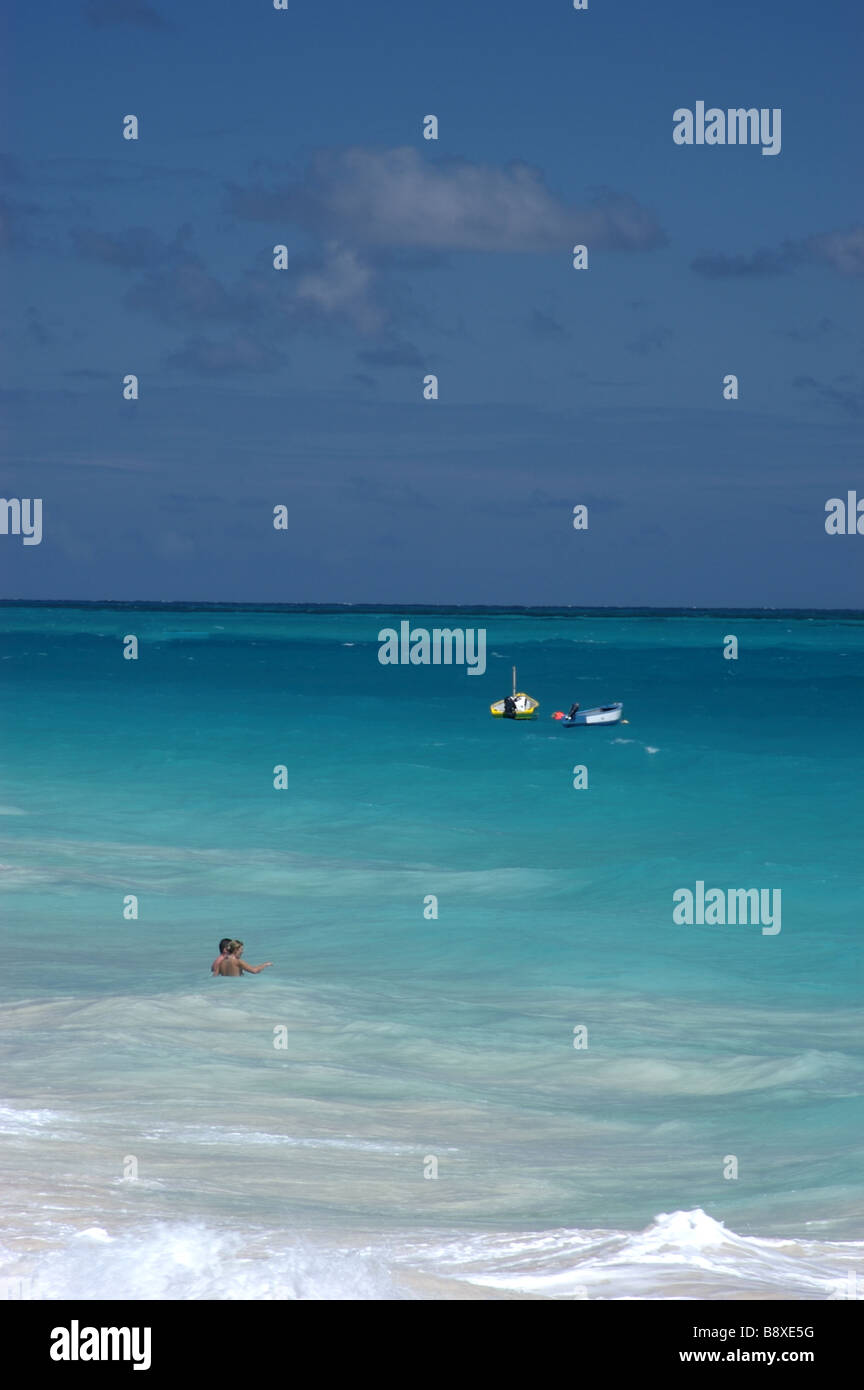 Couple in the water on Crane Beach,Barbados in the Caribbean Stock Photo