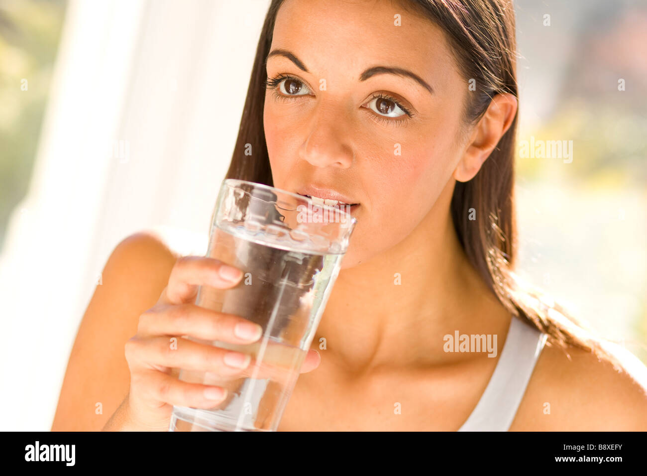 Girl drinking glass of water Stock Photo