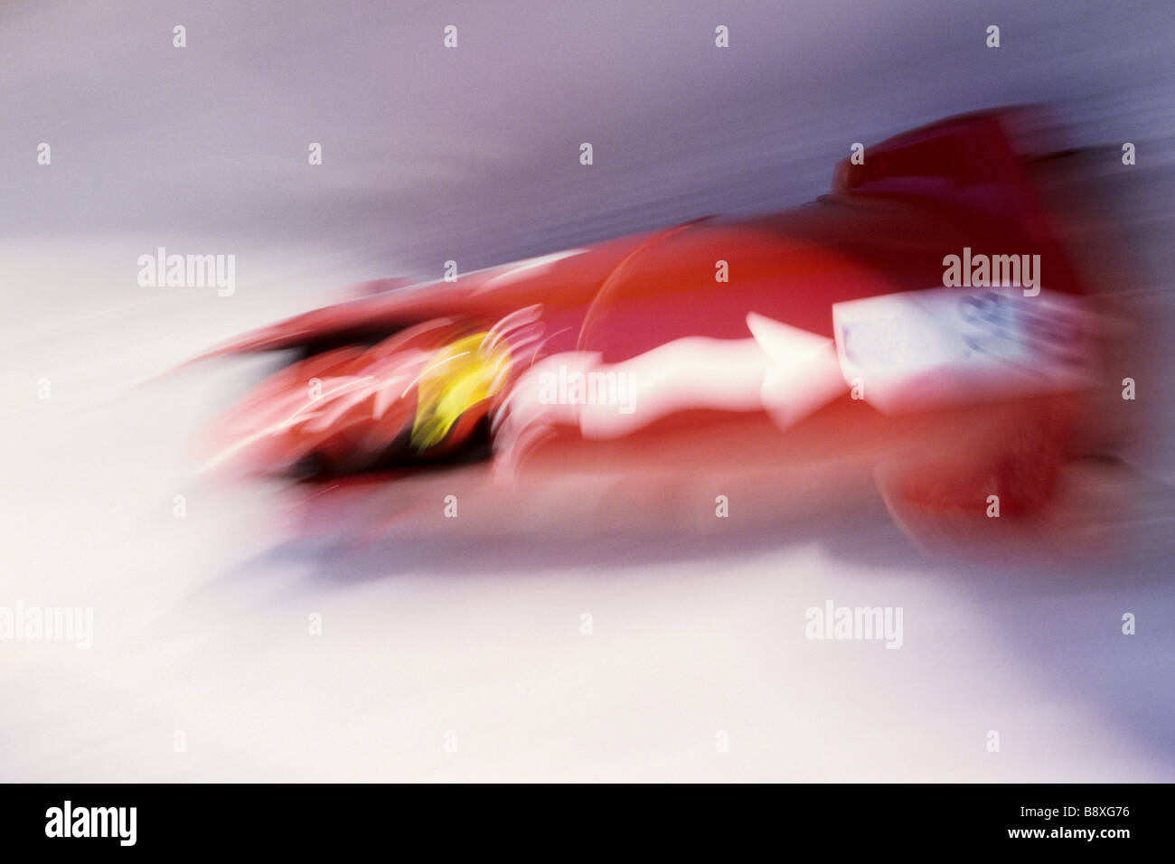 Blurred action of 4 man bobsled team Stock Photo - Alamy