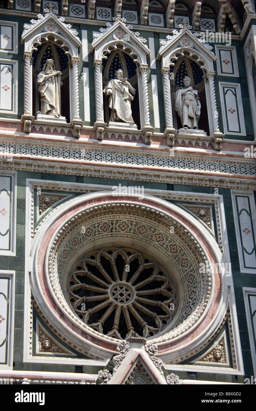 Rose window & Statues on the facade of the Duomo (cathedral) in the Piazza del Duomo, Florence, Tuscany, Italy. Stock Photo