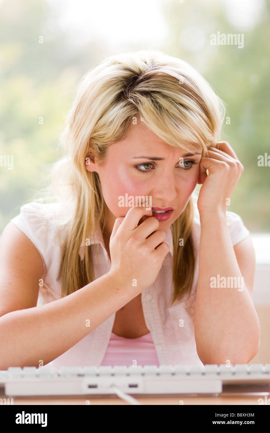 Girl looking at online dating website Stock Photo