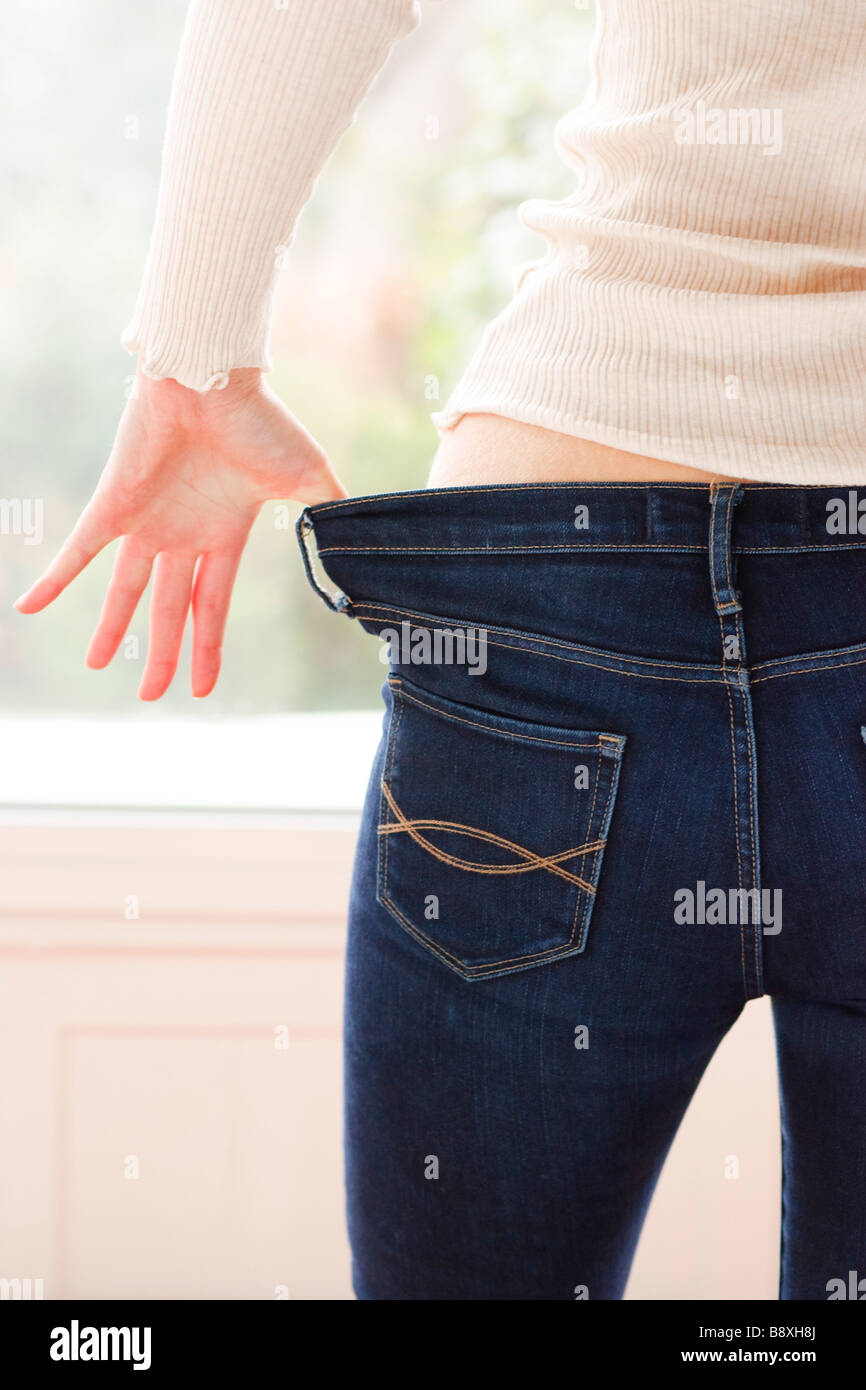 Woman pulling down pants hires stock photography and images Alamy