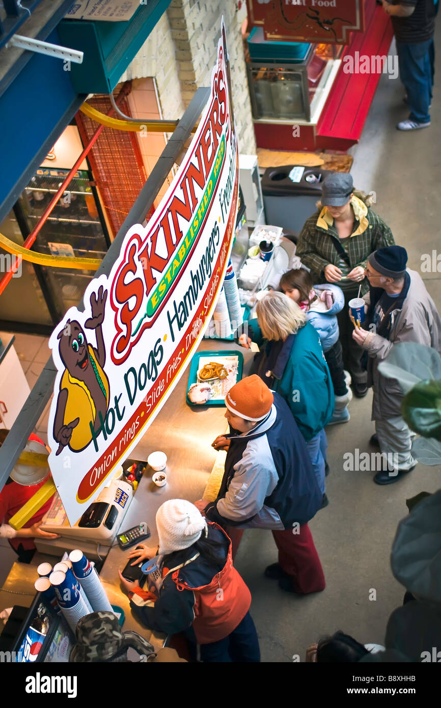 Hi angle view of people ordering at a fast food stand. Stock Photo