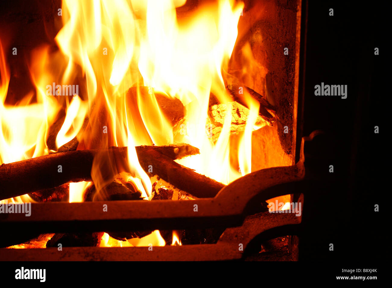 Flames leap from an open fire burning coal and wood Stock Photo Alamy