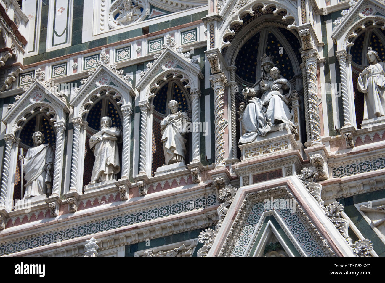 Statues on the facade of the Duomo (cathedral) in the Piazza del Duomo, Florence, Tuscany, Italy. Stock Photo