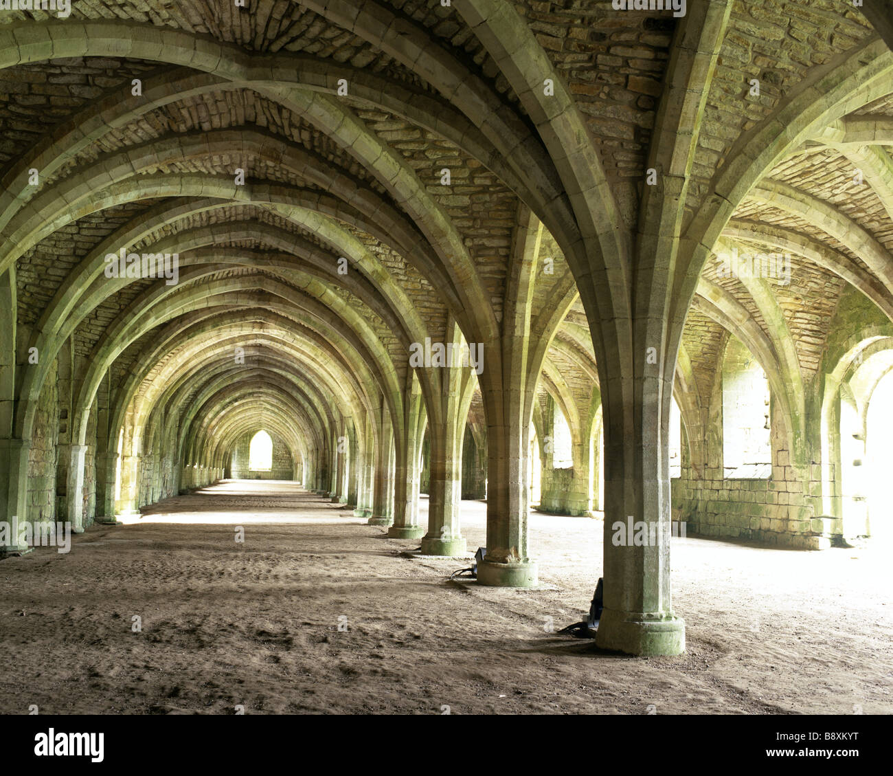 An interior view of the Lay Brothers Refectory inside Fountains Abbey The arches and columns
