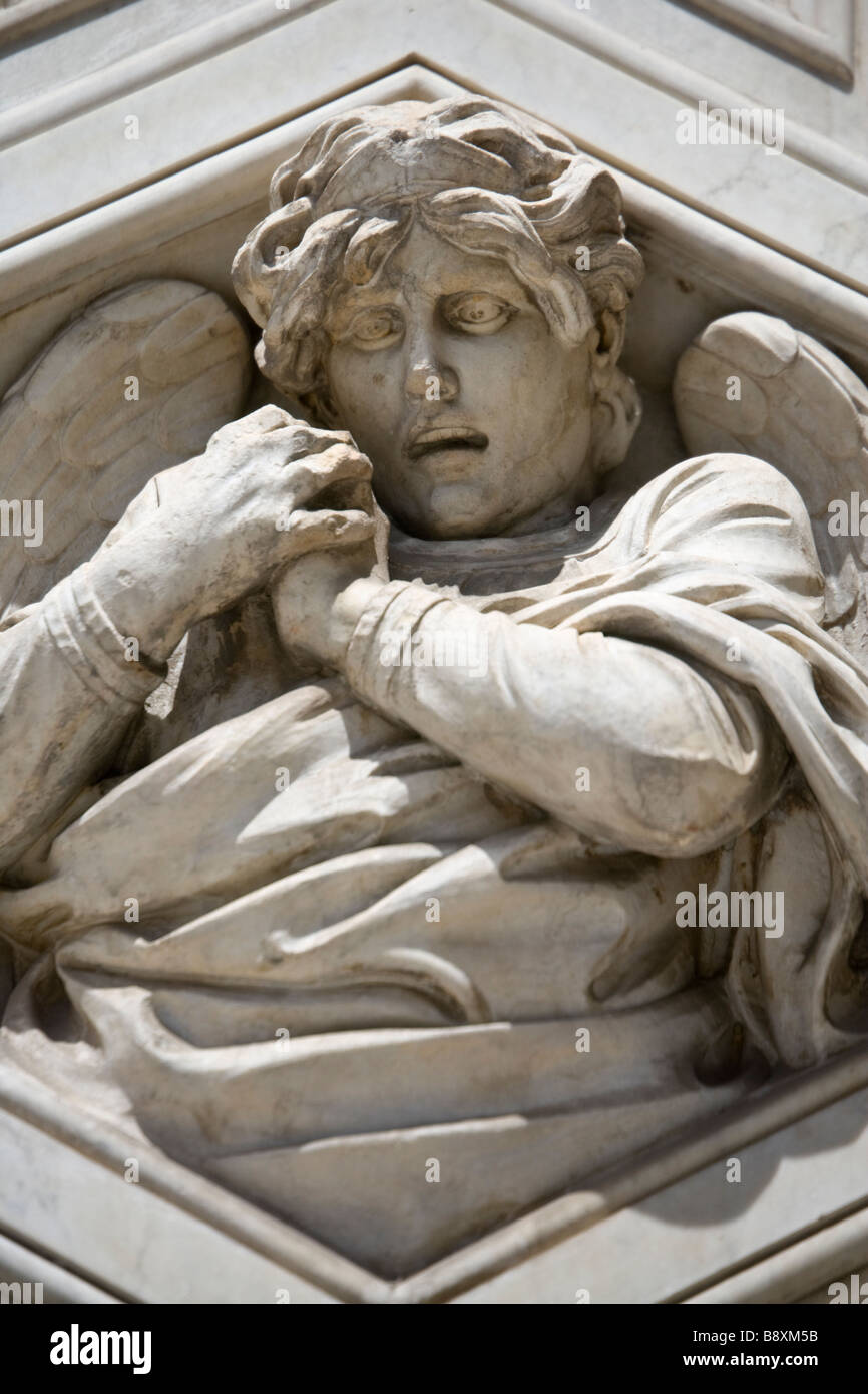 Carved angels on the facade of the Duomo (cathedral) in Florence, Tuscany, Italy. Stock Photo
