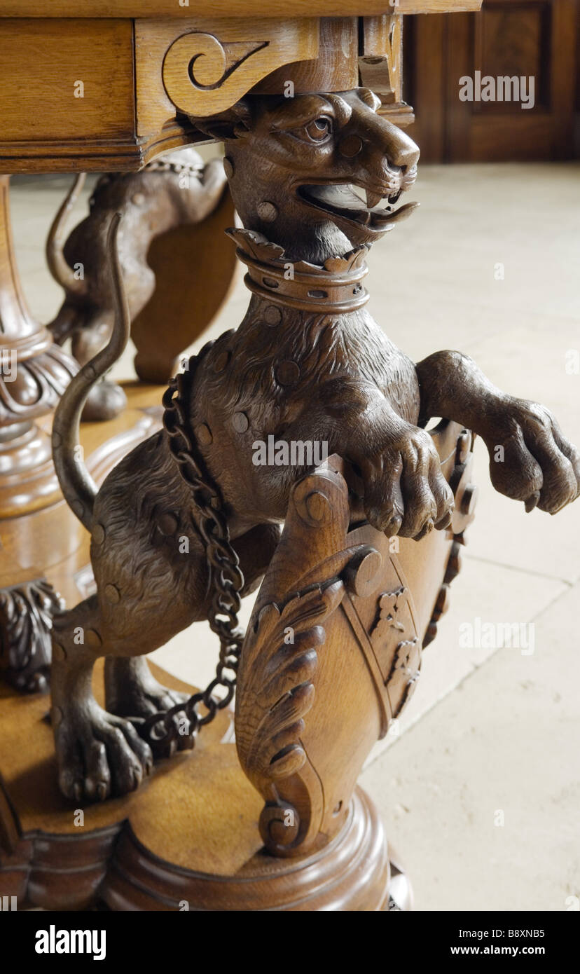 Detail of carved wooden table leg depicting the Hervey snow leopard in the Entrance Hall at Ickworth Suffolk Stock Photo