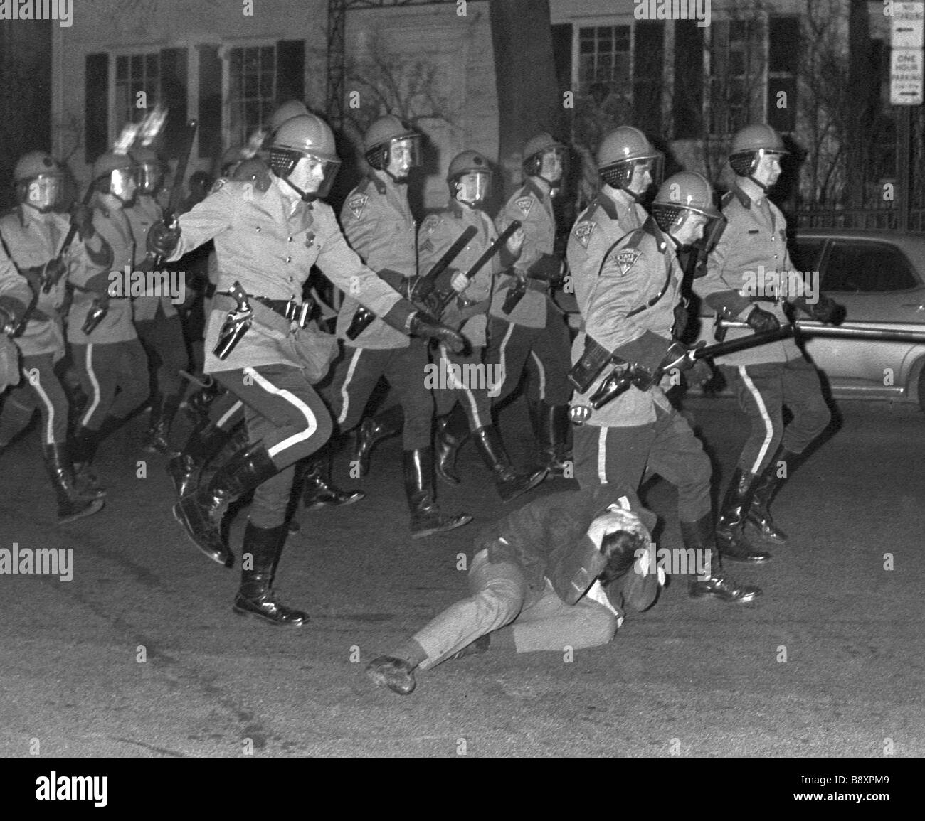 Massachusetts State Troopers in riot gear assault a protester at an ...
