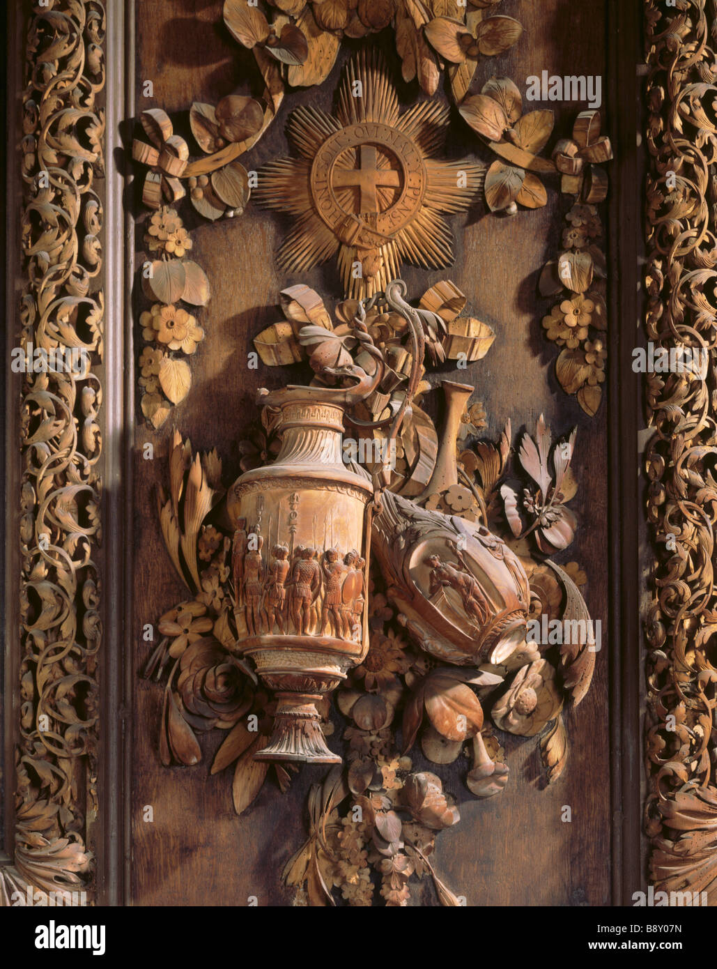 Details of lime wood carving in the Carved Room at Petworth The classical vases on the east wall