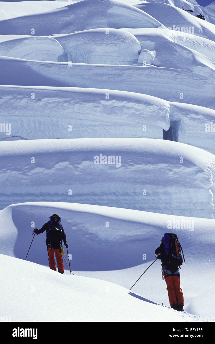 Rear view of a couple ski mountaineering, Ruth Gorge, Alaska, USA Stock Photo