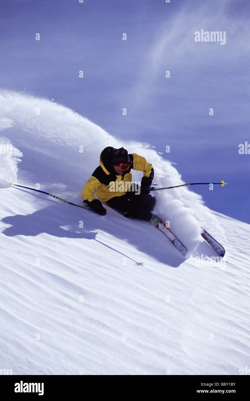 Man skiing on a snow covered mountain, Snowbird Ski Resort, Utah, USA Stock Photo