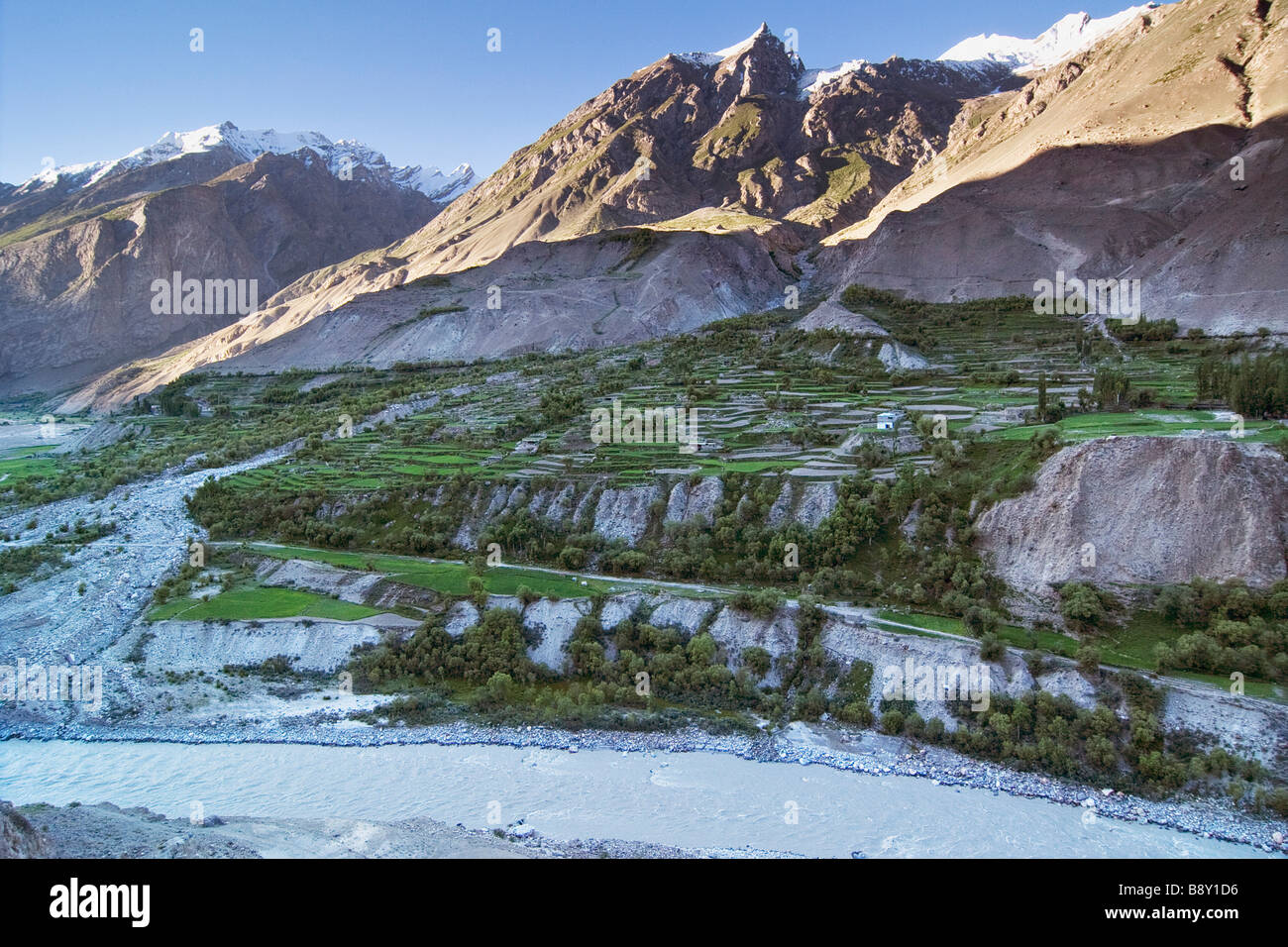 Terrace fields at the downside of a mountain range, Baltoro River, Karakoram Range, Baltistan, Pakistan Stock Photo