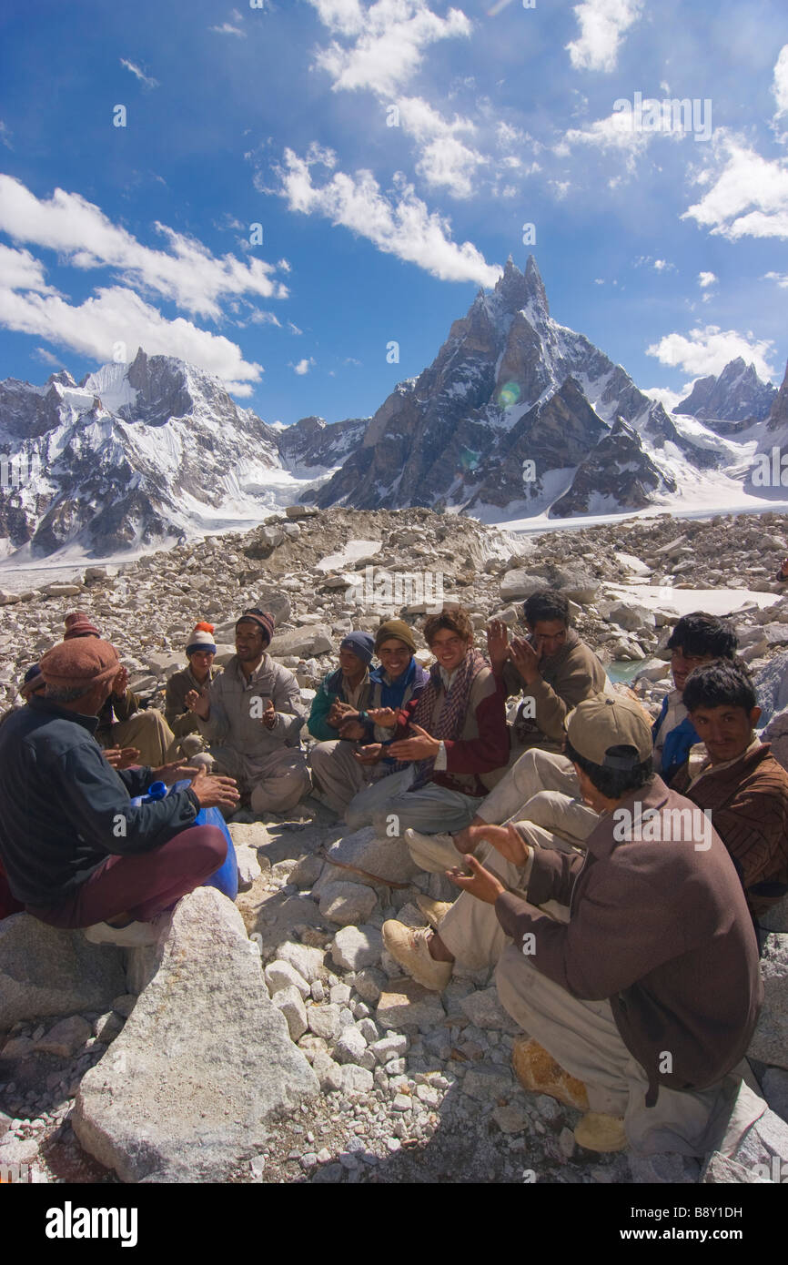 Group of Pakistani men singing, Biafo Glacier, Karakoram Range, Pakistan Stock Photo