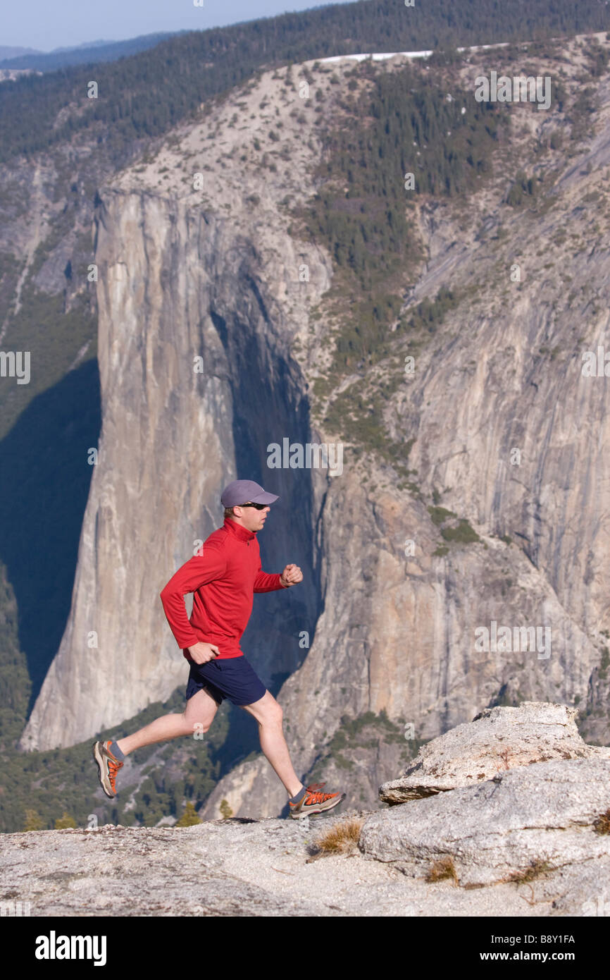 Man running on rocks, El Capitan, Yosemite National Park, California, USA Stock Photo