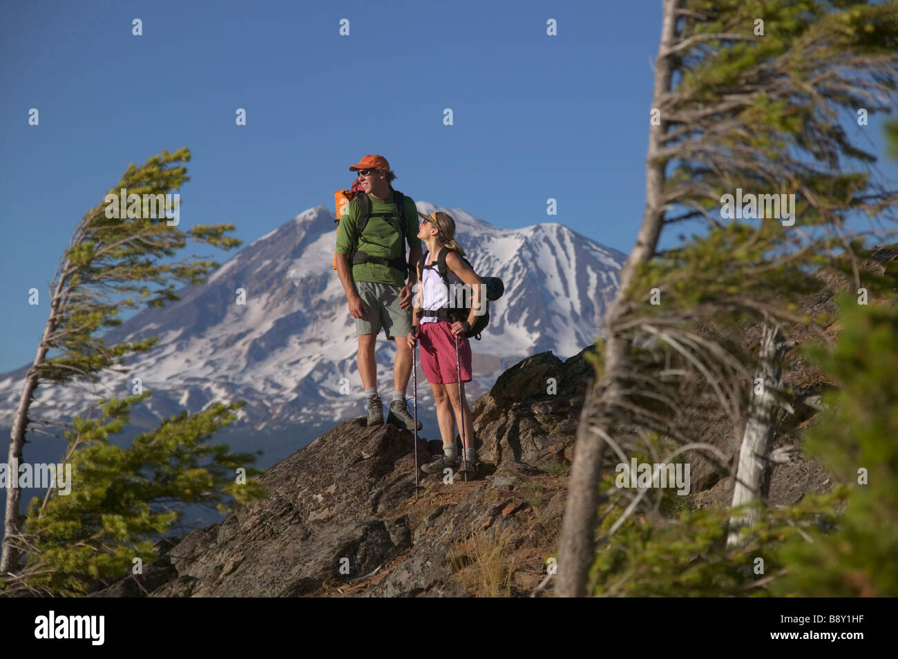 Couple standing on a mountain summit, Mt Adams, Washington State, USA Stock Photo