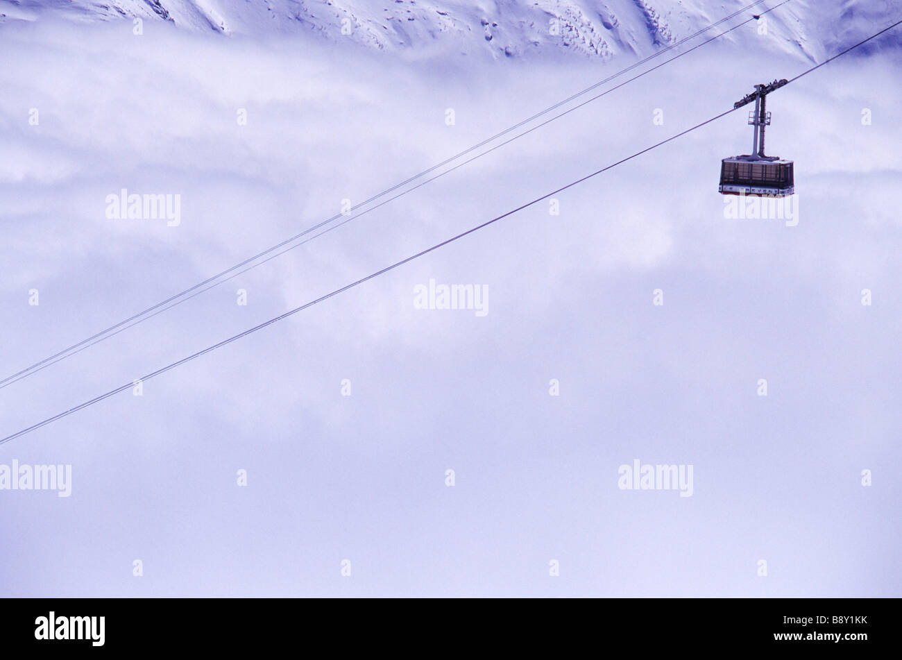 Overhead cable car over a snow covered mountain, Chamonix, Haute-Savoie, Rhone-Alpes, France Stock Photo