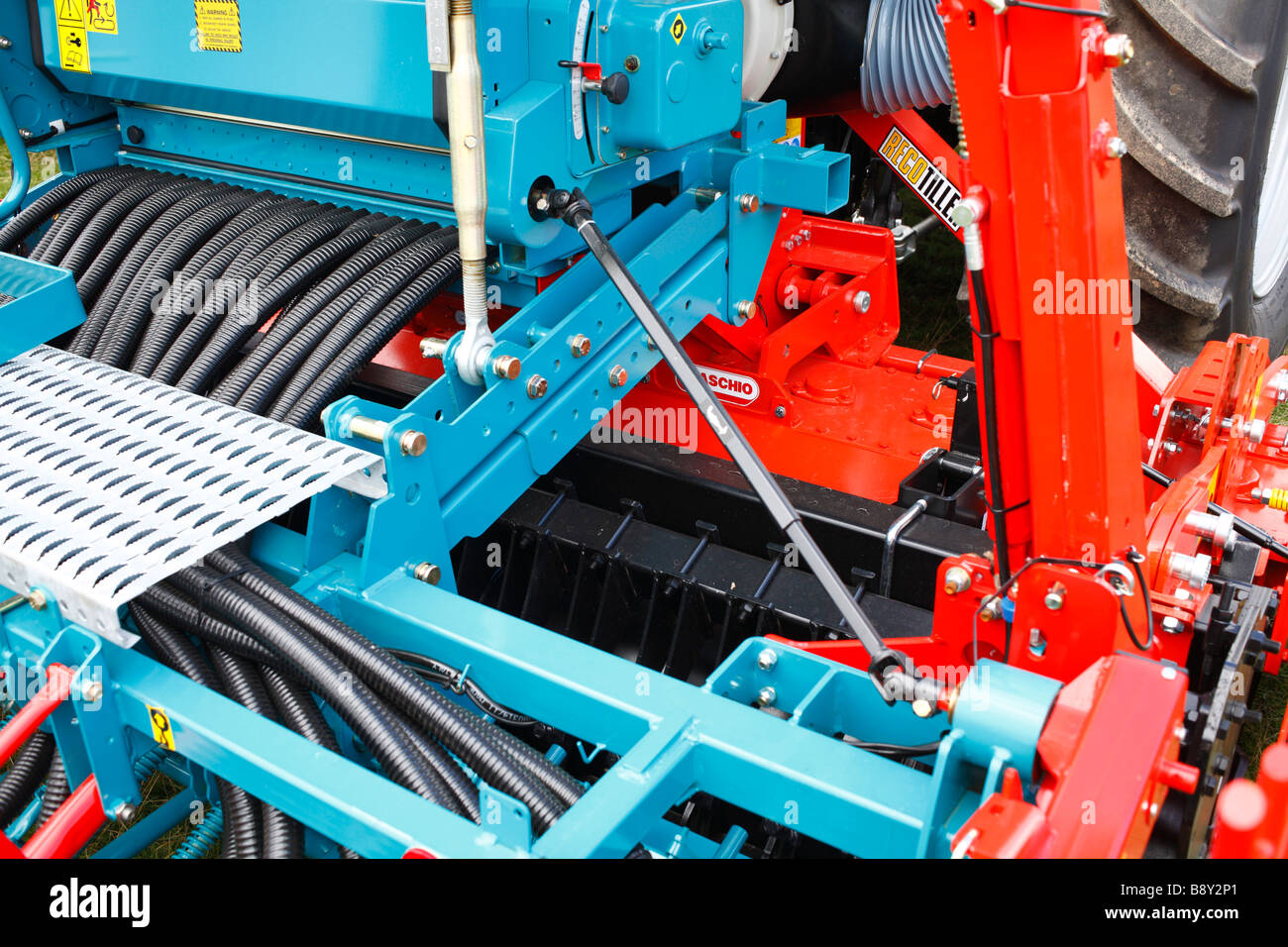 Farm Machinery. Part of a power harrow cultivator/seed drill combination. New equipment at an agricultural show. Stock Photo