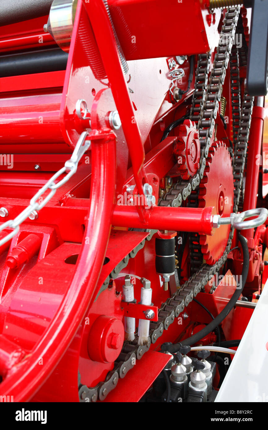 Farm Machinery. Some of the chains and gears working a round baler. New equipment at an agricultural show. Stock Photo