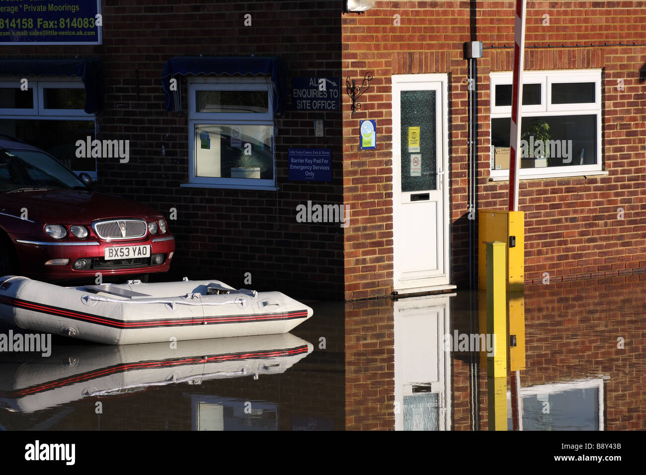 office building car boat dinghy flood flooding river medway yalding
