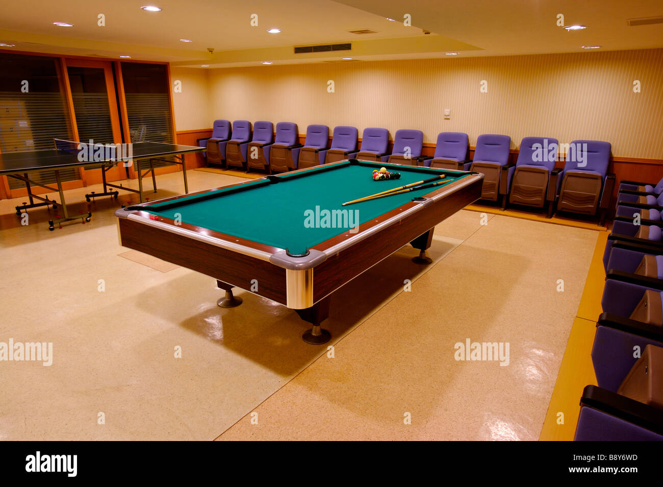 Interior design of gymnasium with pool table and chairs Stock Photo Alamy