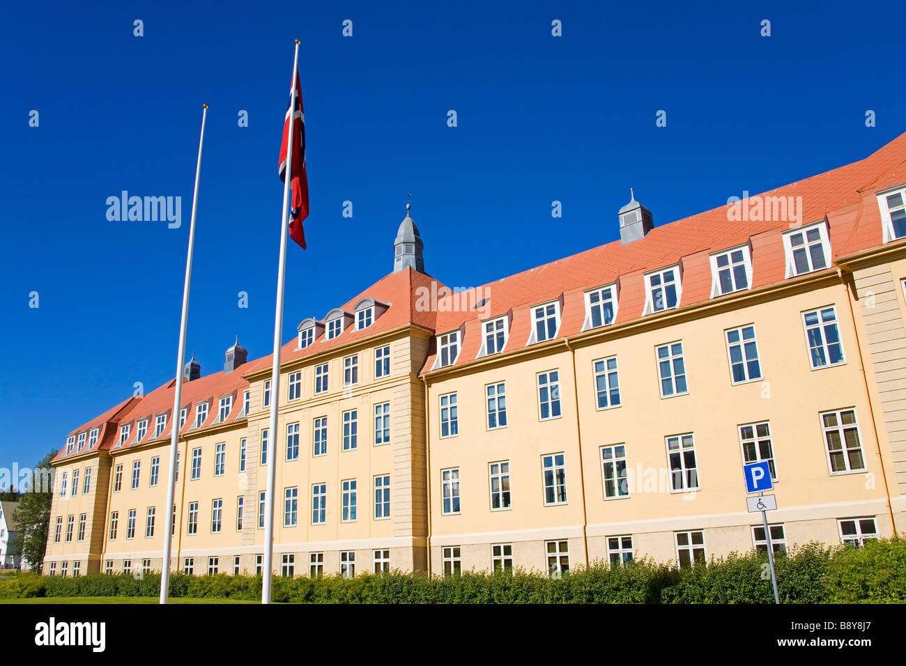 Flags in front of a county hall, Troms County Hall, Tromso, Toms County, Nord-Norge, Norway Stock Photo