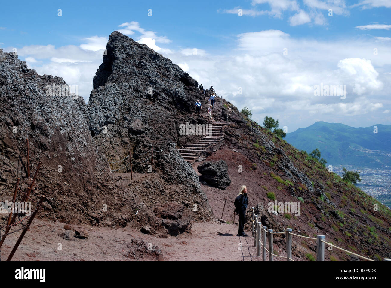 Hiking along Crater rim of Vesuvius volcano, Pompeji below, Campania, Italy Stock Photo