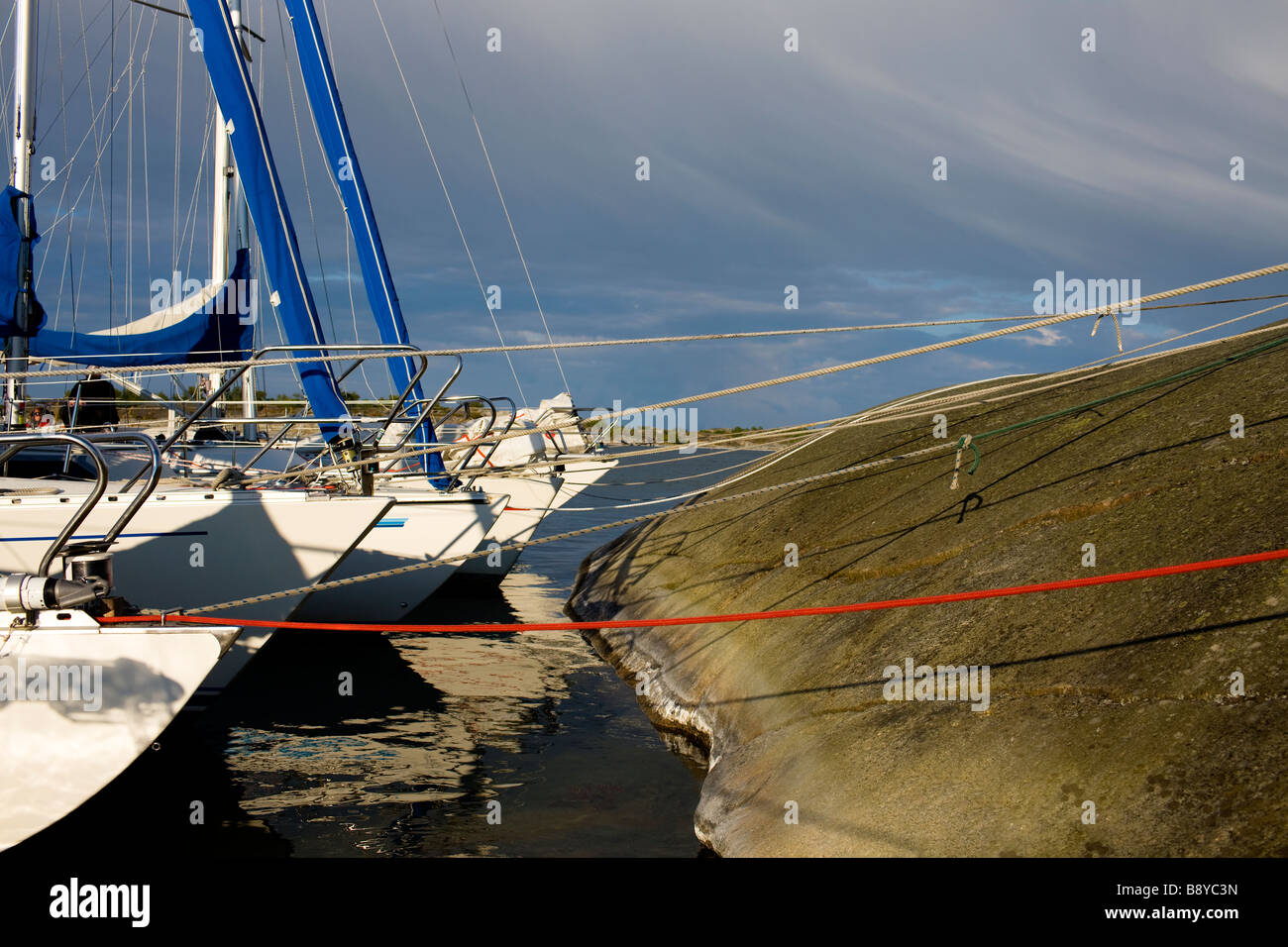 Sailingboats by a cliff Sweden Stock Photo Alamy