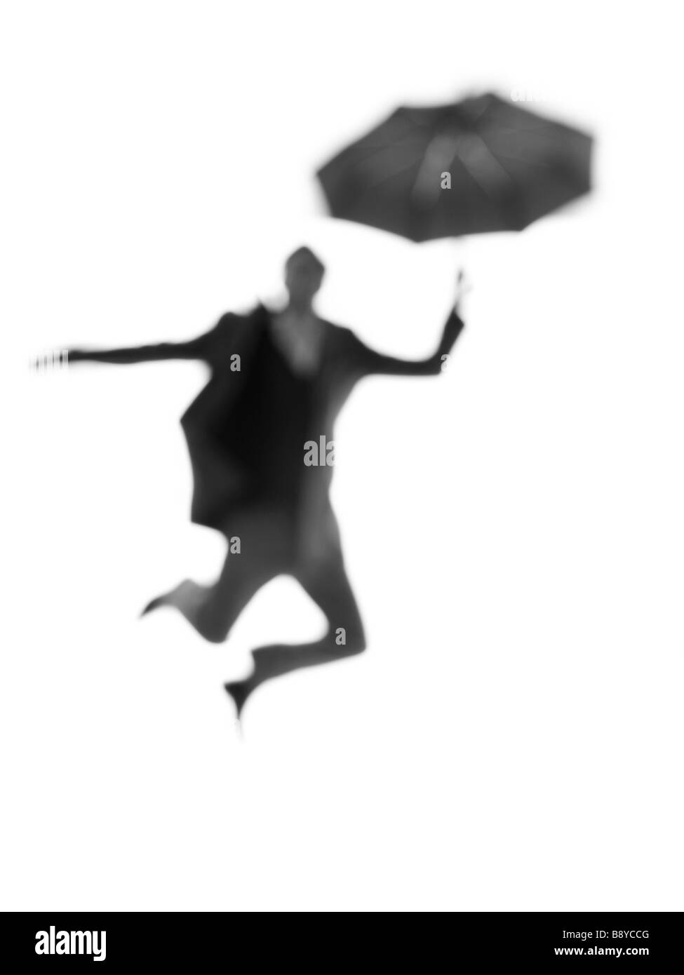 Silhouette of a man with an umbrella. Stock Photo