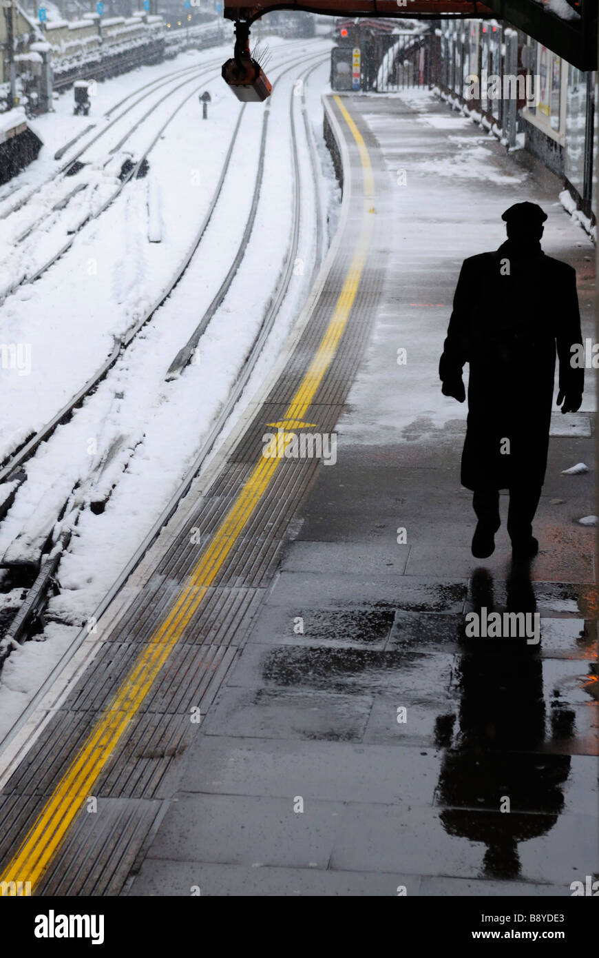 Commuter waiting for an underground train to arrive at Farringdon Tube Station during Stock Photo