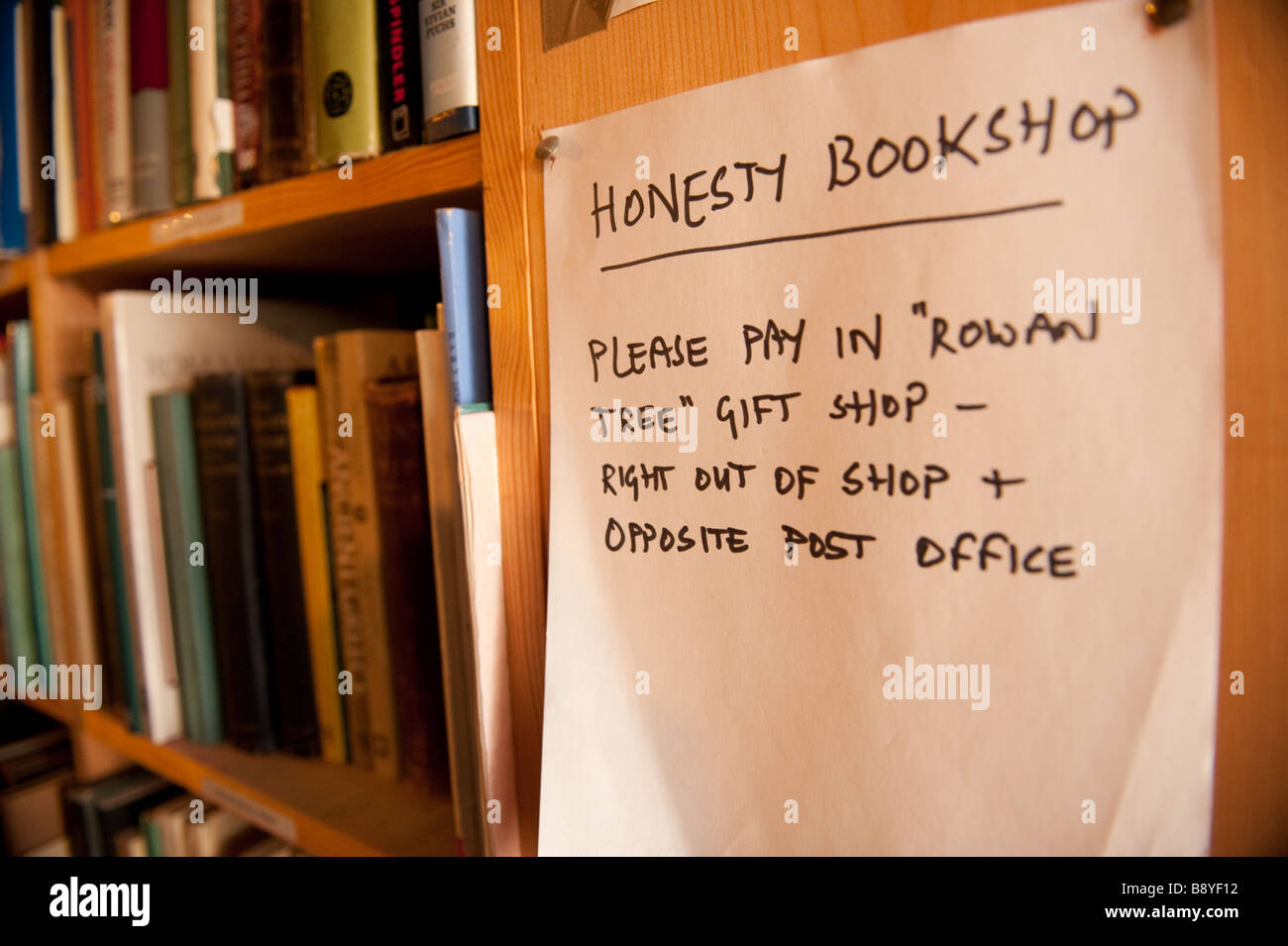 A handwritten notice in the unattended honesty bookshop in Presteigne village Powys on the welsh english border Wales UK Stock Photo