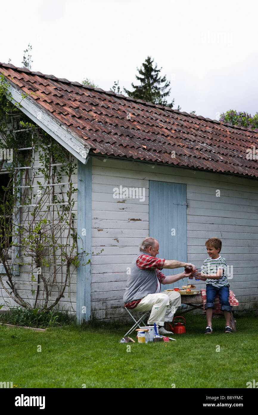 Grandfather and grandson at the summer cottage Sweden Stock Photo Alamy