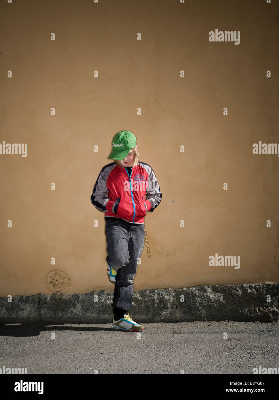 A boy standing in front of a wall Sweden. Stock Photo