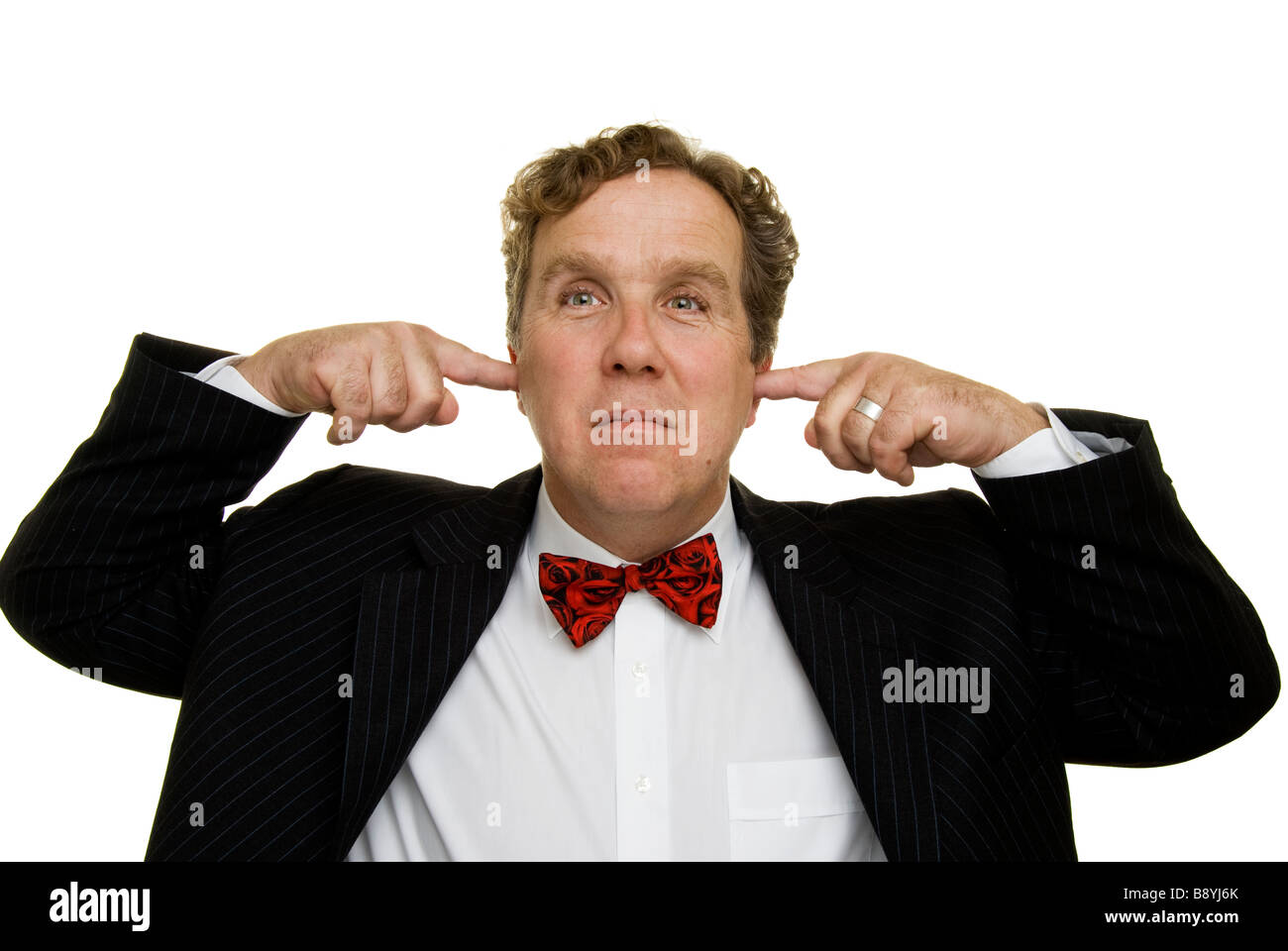 man with fingers in ears not listening Stock Photo - Alamy