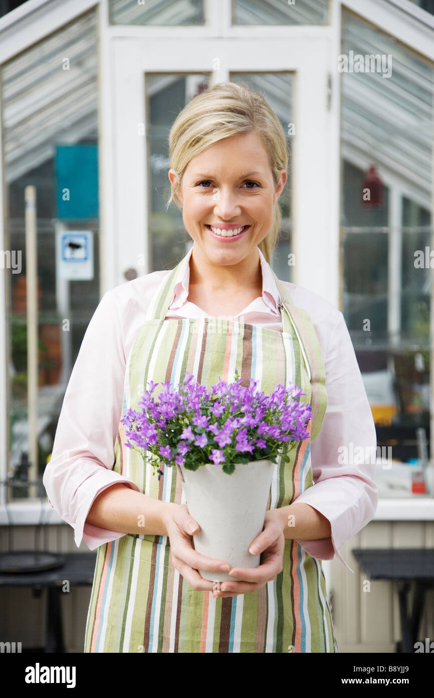 A blond woman working in a flower shop Sweden Stock Photo - Alamy
