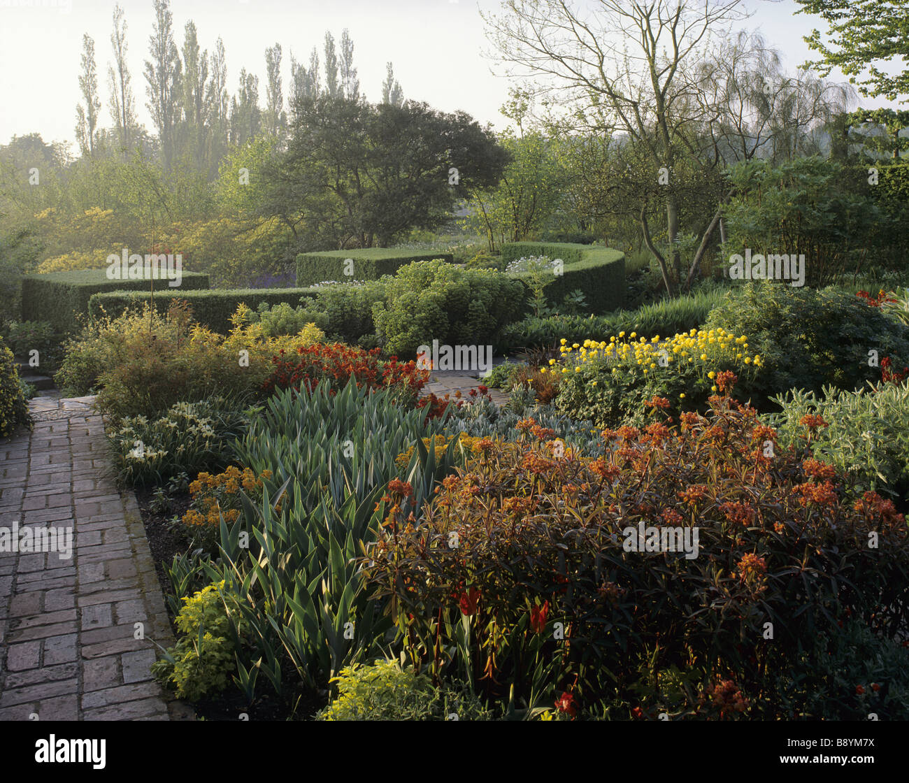 The yew hedge surrounding the Rondel in the Rose Garden with a ...