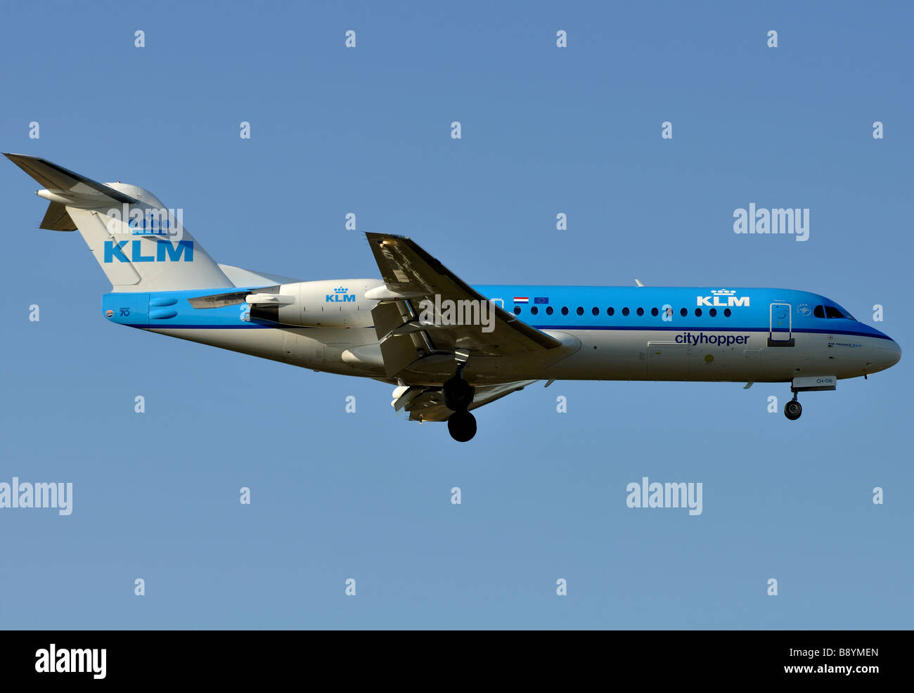 KLM Cityhopper Fokker 70 aircraft landing at Birmingham International Airport, UK Stock Photo