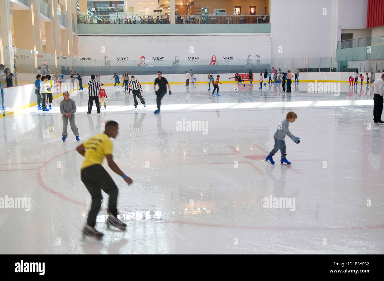 skaters on ice rink in shopping mall, dubai, uae Stock Photo
