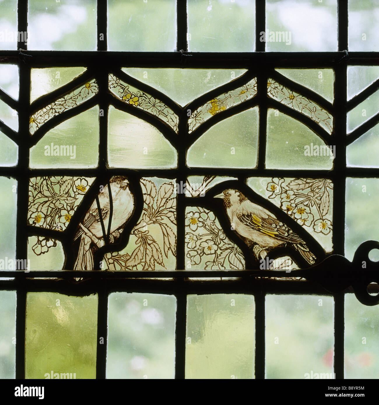 Stained glass panel of birds in a side window of the Solar at Stoneacre