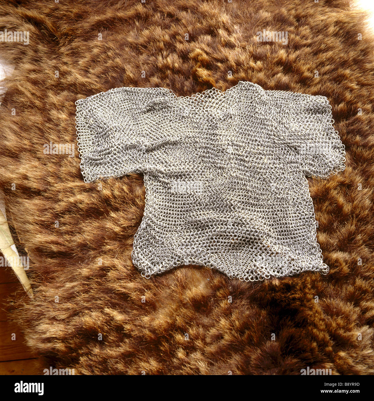 Replicas of finds from the Sutton Hoo Saxon burial site chain mail shirt on a bear skin Stock Photo
