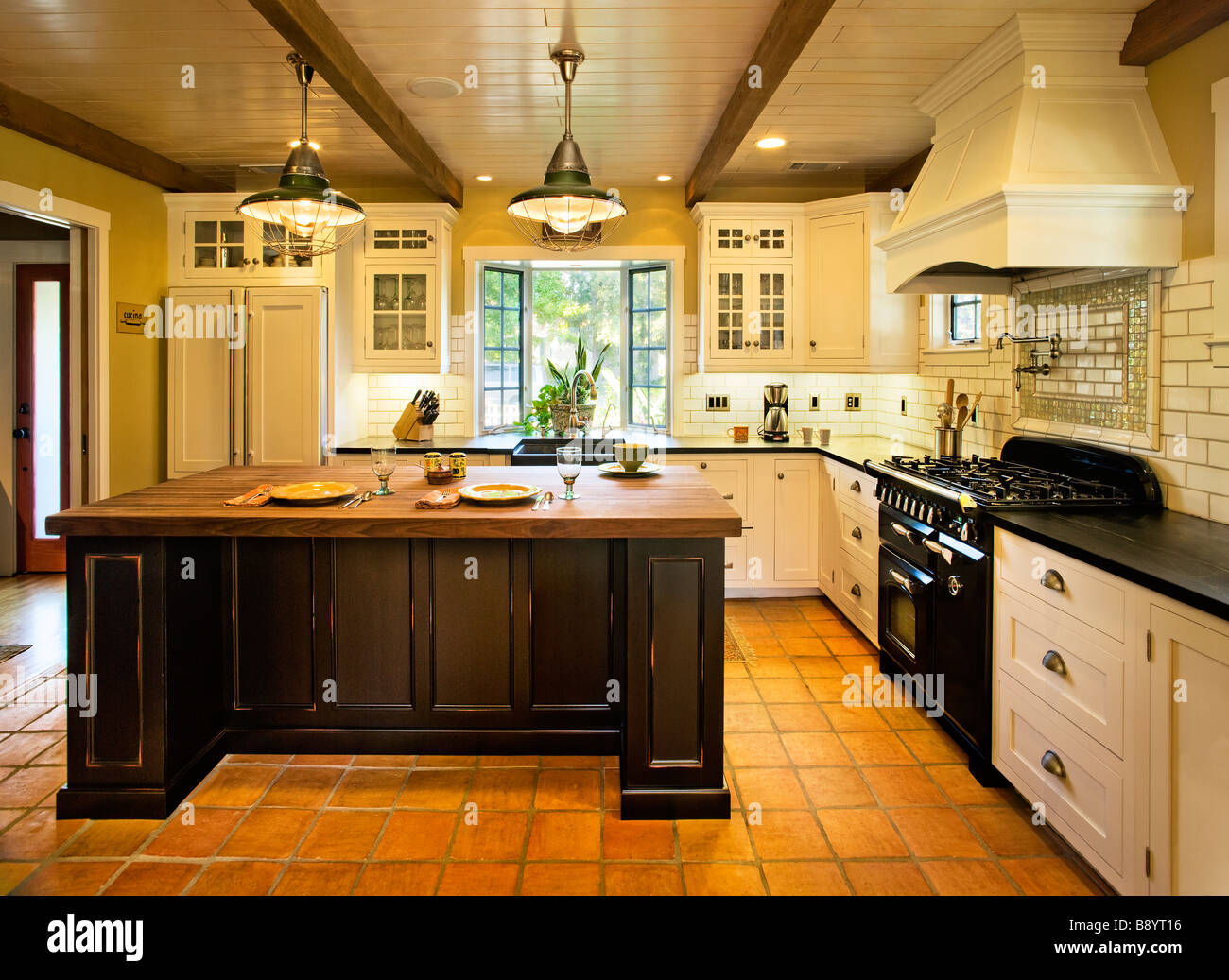 Contemporary kitchen in spanish style home Stock Photo Alamy