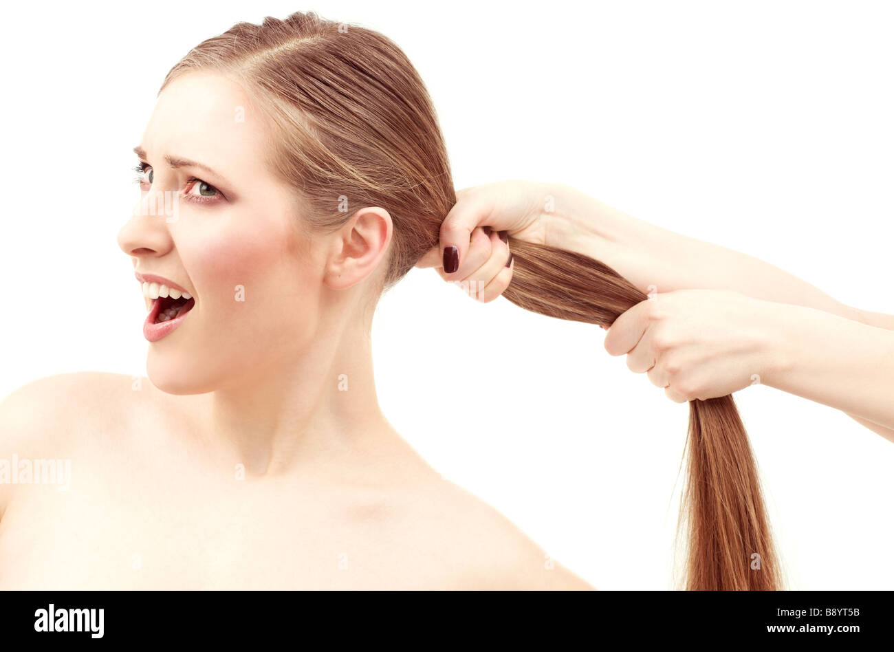 lovely woman face and female hands pulling her hair Stock Photo Alamy