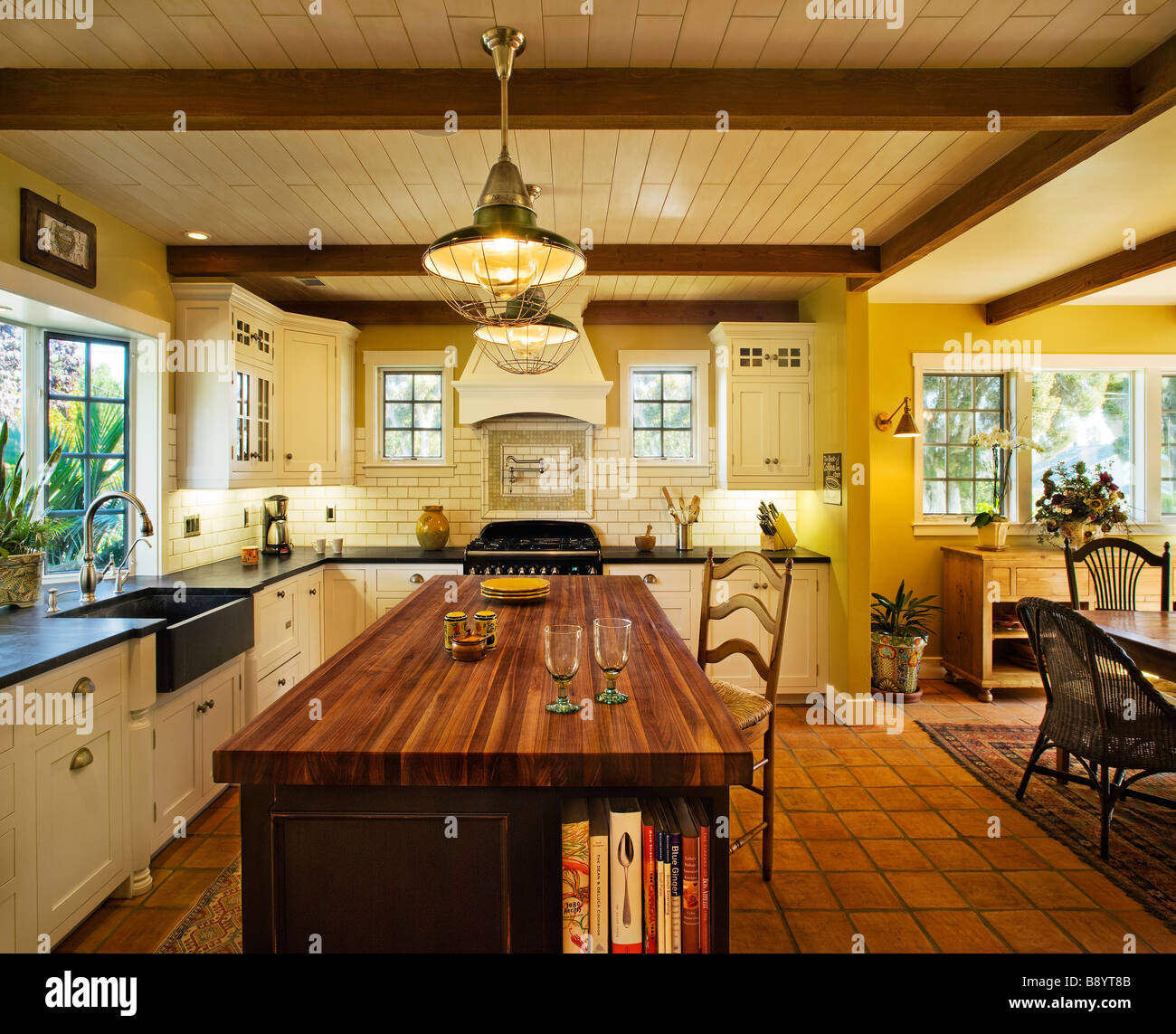 Contemporary kitchen in spanish style home Stock Photo - Alamy