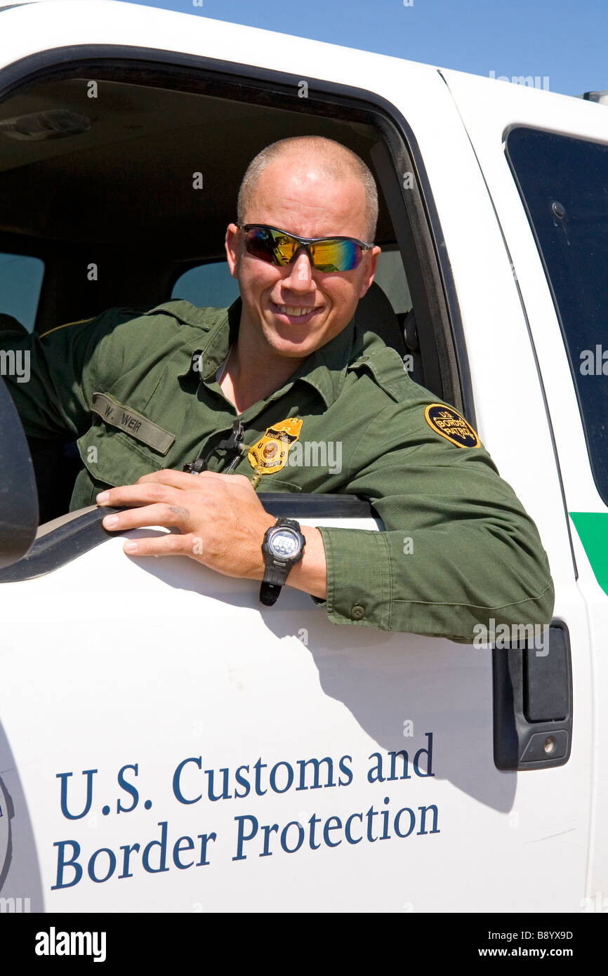 United States Border Patrol agent at the U S Mexico border along the All American Canal near Calexico California Stock Photo