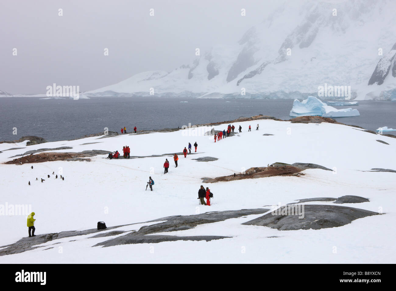 Tourists explore Pleneau Island on the Antarctic Peninsula Antarctica Stock Photo