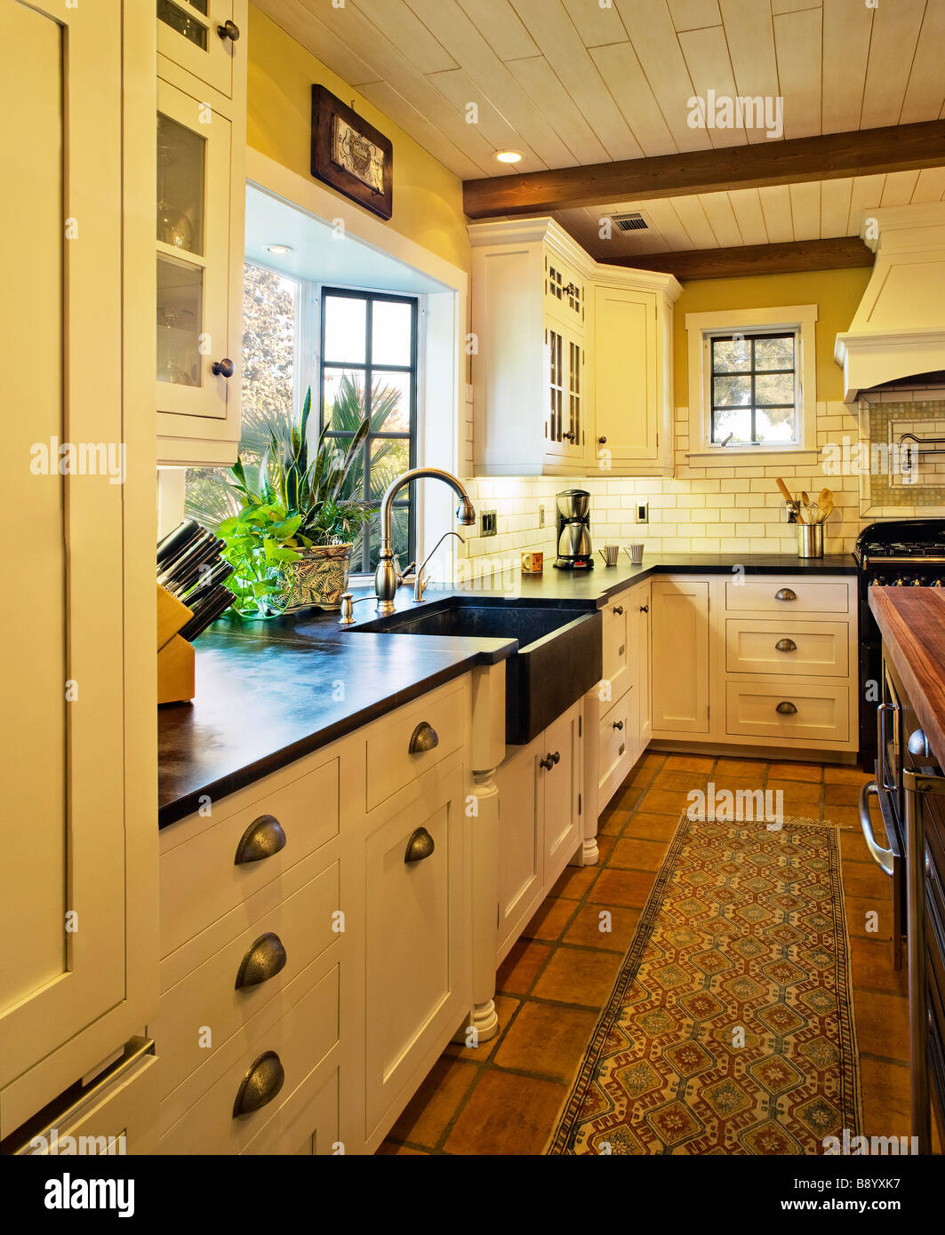 Contemporary kitchen in spanish style home Stock Photo Alamy